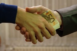 person paying a bribe