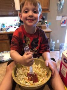child making salad