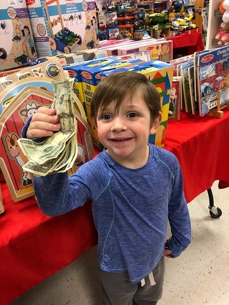 kid carrying money 